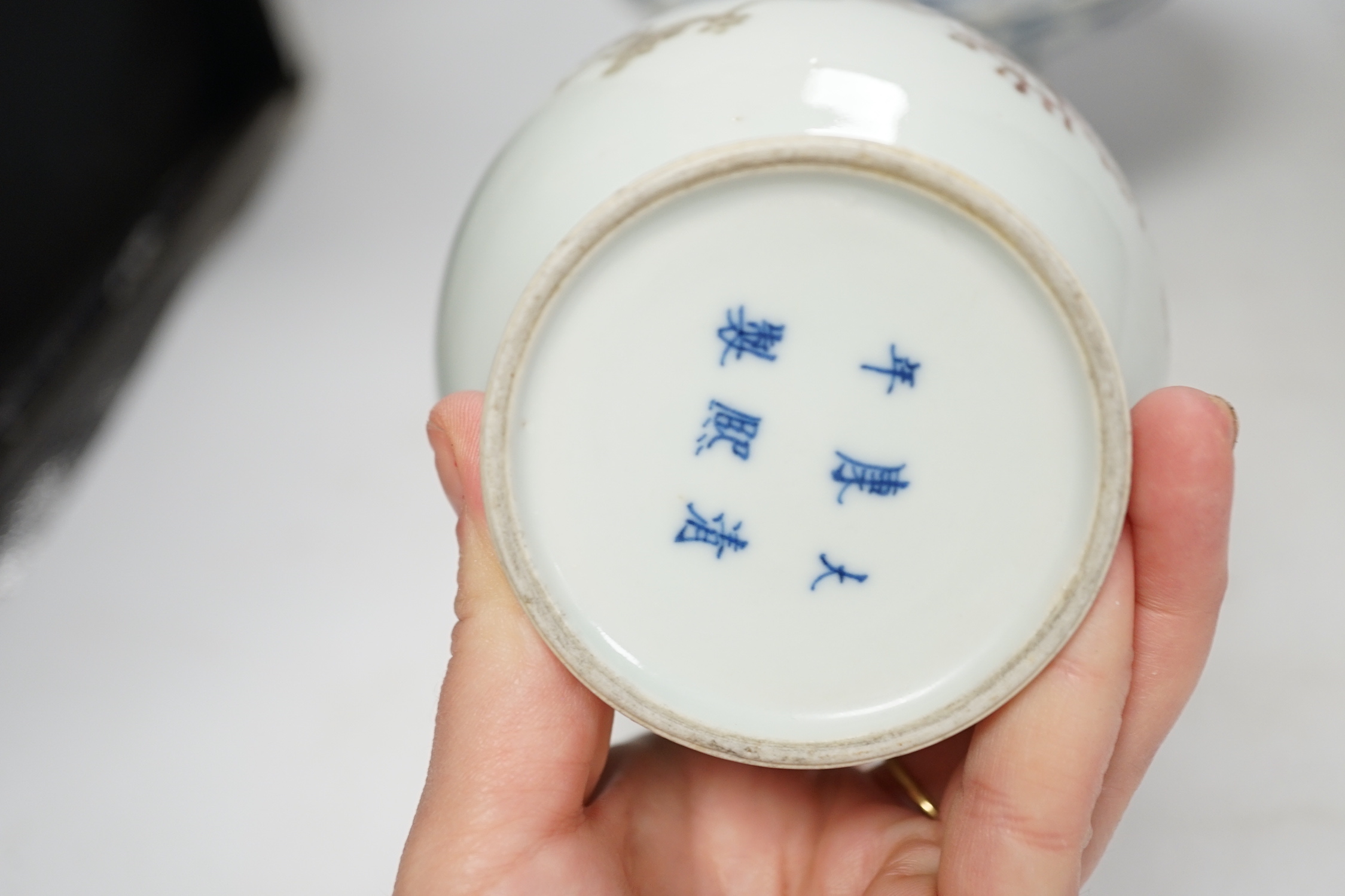 A Chinese underglaze copper red ‘herder and goats’ vase, Kangxi six character mark but Republic period and a Chinese blue and white lotus stem dish, six character Guangxu mark and period, both damaged